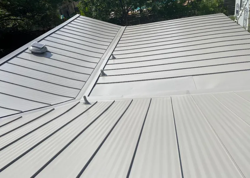 Solar attic fan installed on a metal roof for Roof Ventilation in Park City